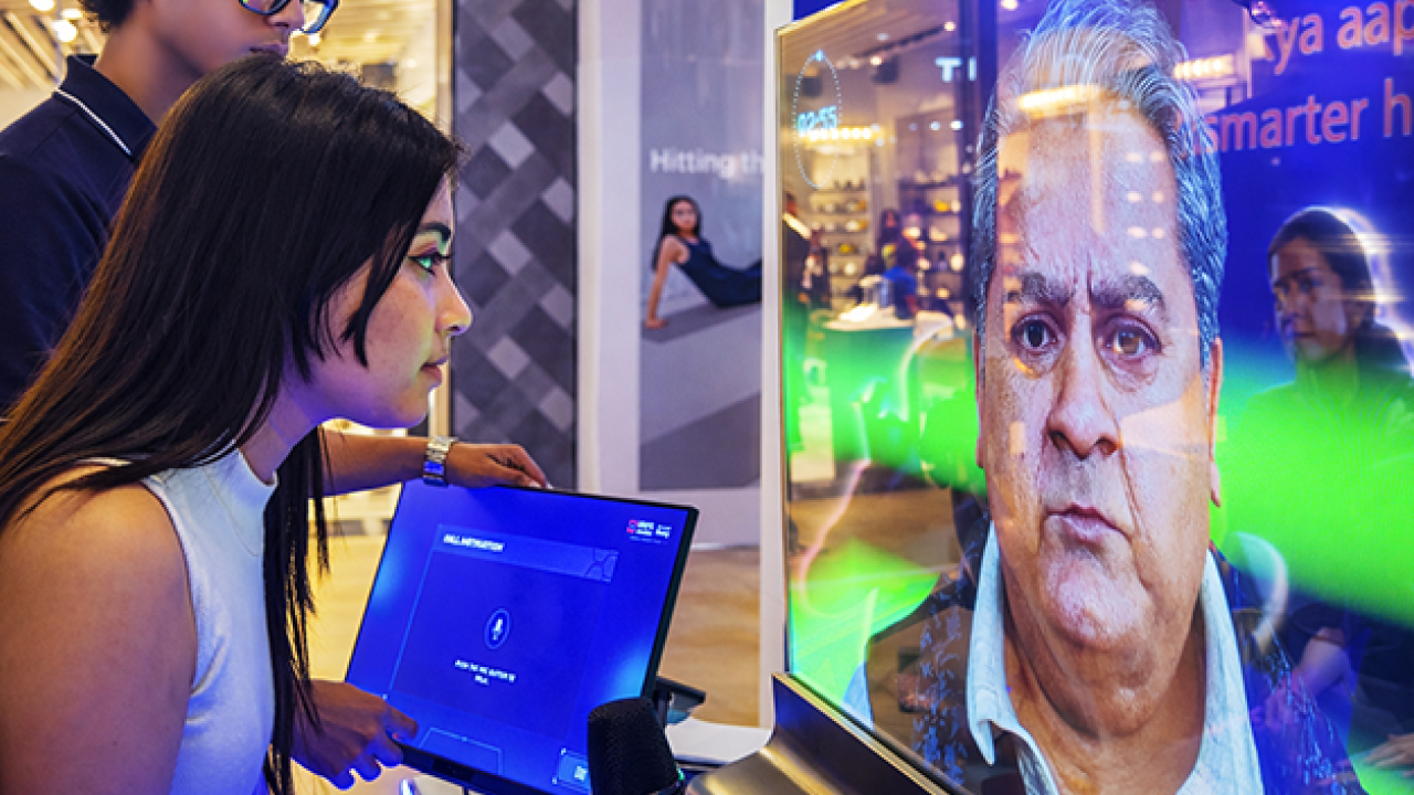 Visitor interacting with AI scammer avatar experience